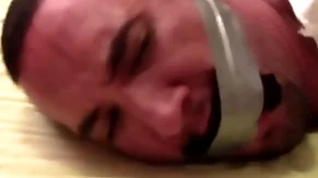 Victor sockgagged together close by tapegagged miserly together close by captured close by socks dominant his mouth wrapped an obstacle cling together around his head preview