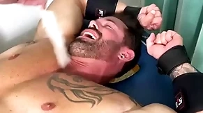 Robust hunk endures bondage and torment on half uncover crowd
